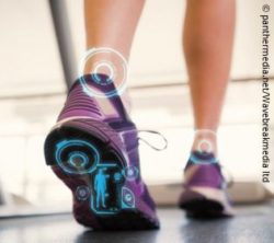 Photo: A woman's legs walking on a treadmill. There are digital inserts on the ankles and the sole of the foot; Copyright: panthermedia.net/Wavebreakmedia ltd