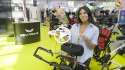 User with a Frame Runner at REHACARE 2025; linked to the video