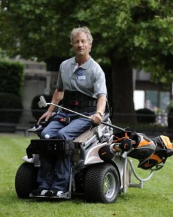 Photo: Person in Power Base Tec wheelchair playing golf at REHACARE; Copyright: Messe Düsseldorf/ctillmann