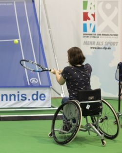 Photo: Woman in a wheelchair playing wheelchair tennis in the BRSNW Sports Center at REHACARE; Copyright: Messe Düsseldorf/ctillmann