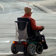 Photo: Elderly woman in an electric wheelchair